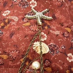 Seashell necklace with pearl starfish.